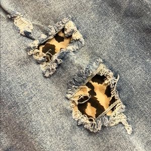 Ripped jeans with animal print